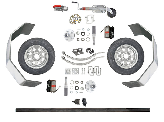 Trojan 1500kg single axle non-braked trailer kit parts laid out - wheels, axle, springs, hubs, guards, lights and hardware